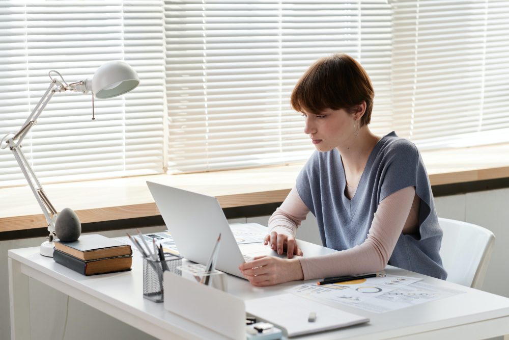 Concentrated woman preparing report