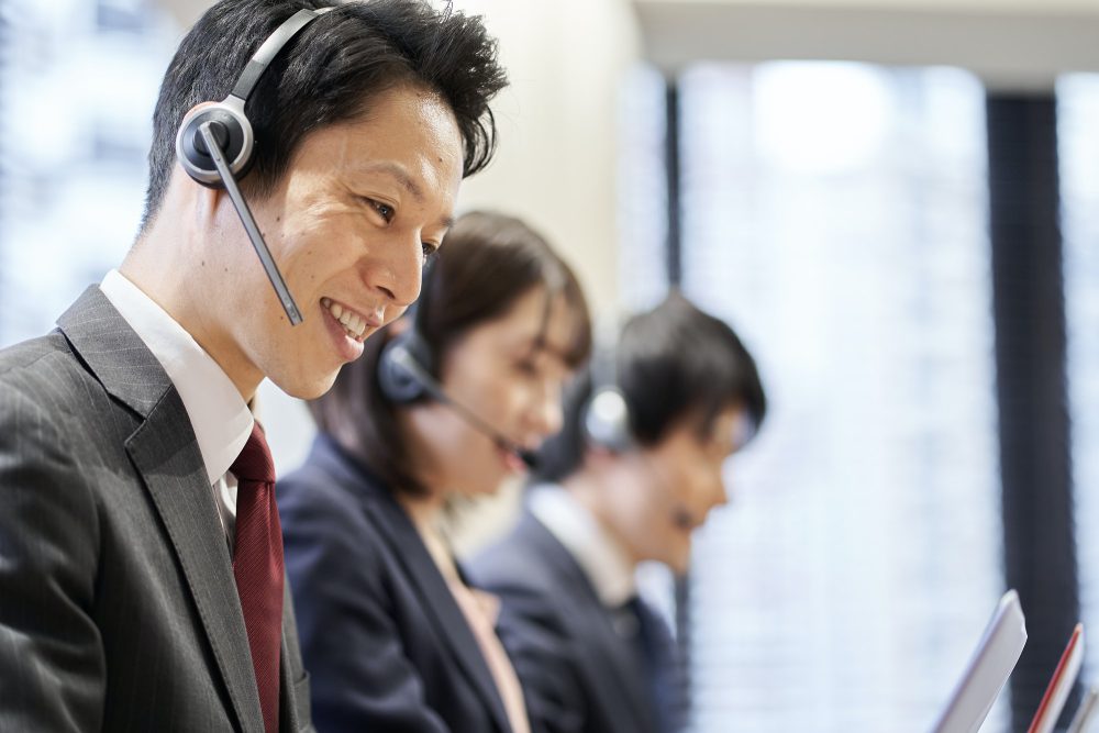 Asian business person responding at the customer center